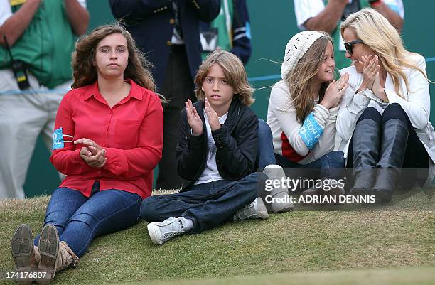 Family of US golfer Phil Mickelson, his wife Amy and children Evan, Amanda Brynn and Sophia Isabel, clap after the former won the 2013 British Open...