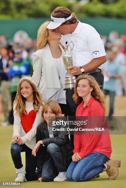 Phil Mickelson of the United States holds the Claret Jug with wife Amy and children Evan, Amanda and Sophia after winning the 142nd Open Championship...