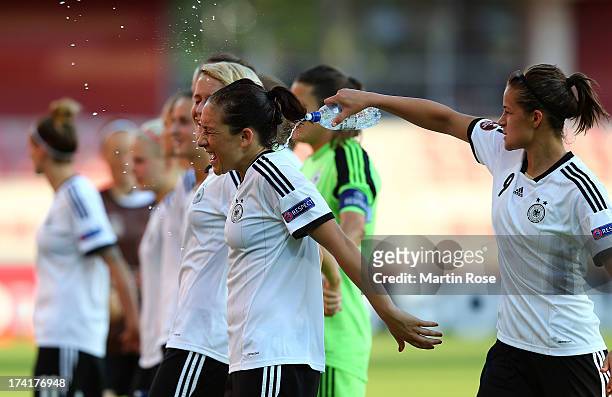 Lena Lotzen of Germany celebrate with team mate Nadine Kessler after the UEFA Women's Euro 2013 quarter final match between Italy and Germany at...
