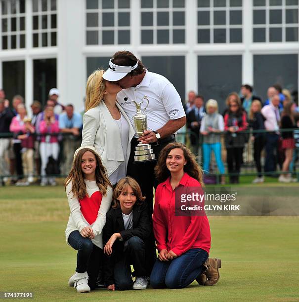 Golfer Phil Mickelson poses for pictures with his wife Amy and children Evan Samuel, Amanda Brynn and Sophia Isabel after winning the 2013 British...