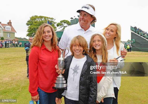 Phil Mickelson of the United States holds the Claret Jug with wife Amy and children Evan, Amanda and Sophia after winning the 142nd Open Championship...