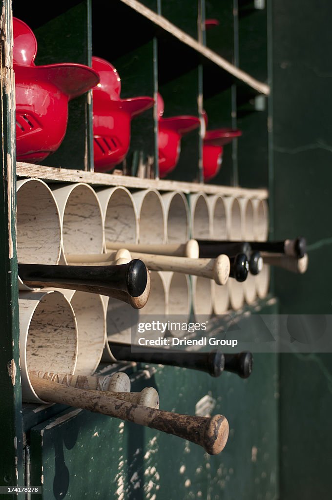 Baseball equipment rack in the dugout.