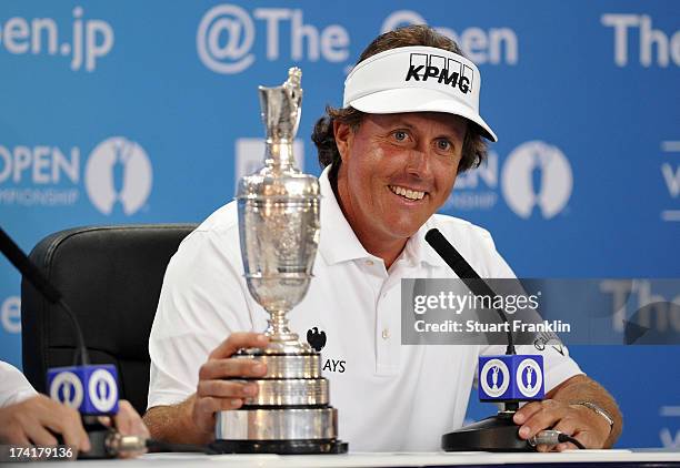 Phil Mickelson of the United States holds the Claret Jug as he answers questions after winning the 142nd Open Championship at Muirfield on July 21,...