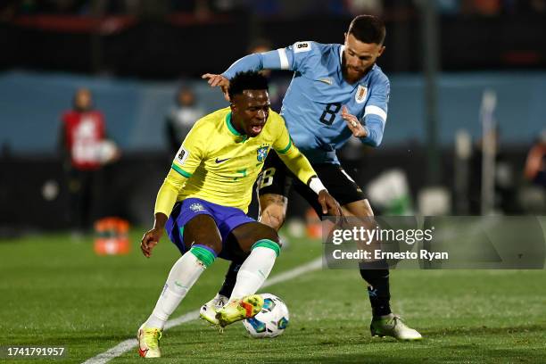 Nahitan Nandez of Uruguay competes for the ball with Vinicius Jr. Of Brazil during the FIFA World Cup 2026 Qualifier match between Uruguay and Brazil...