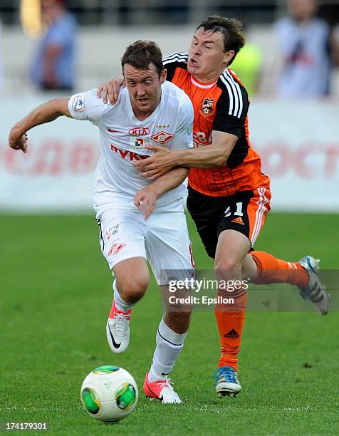 Aleksandr Shchanitsyn of FC Ural Sverdlovsk Oblast challenges Aiden McGeady of FC Spartak Moscow during the Russian Premier League match betweenn FC...