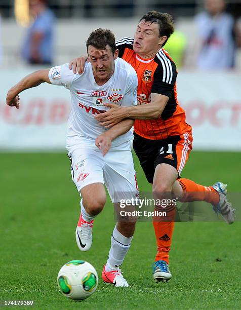 Aleksandr Shchanitsyn of FC Ural Sverdlovsk Oblast is challenged by Aiden McGeady of FC Spartak Moscow during the Russian Premier League match...