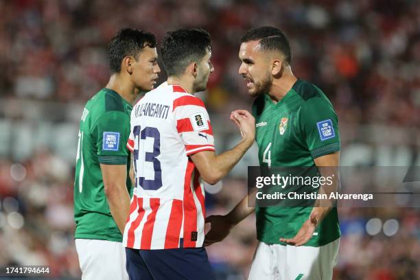 Mathias Villasanti of Paraguay argues with Luis Haquin of Bolivia during the FIFA World Cup 2026 Qualifier match between Paraguay and Bolivia at...