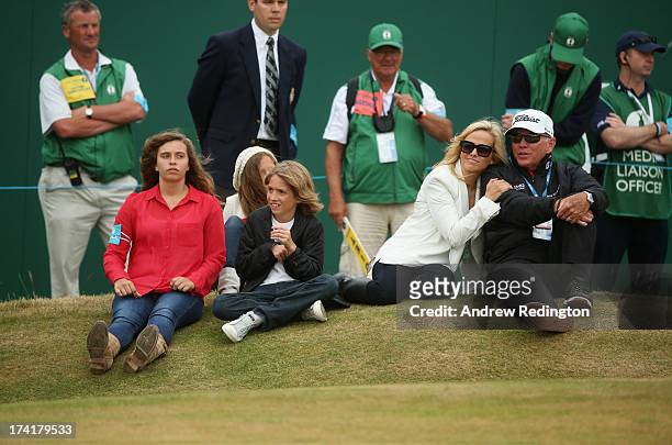 Family of Phil Mickelson, daughters Sophia and Amanda, son Evan, wife Amy and coach Butch Harmon sit by the 18th green during the 142nd Open...