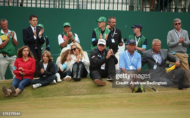 Family of Phil Mickelson,children Sophia, Evan and Amanda, wife Amy, coach Butch Harmon, caddie sit by the 18th green during the 142nd Open...