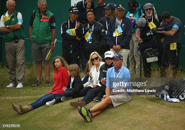 Family of Phil Mickelson, children Sophia and Evan, wife Amy, coach Butch Harmon and caddie Jim Mackay sit by the 18th green during the 142nd Open...