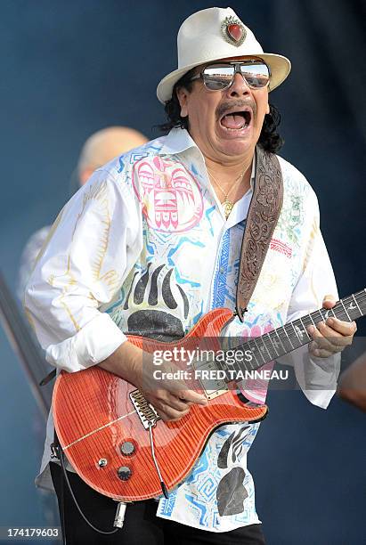 Guitarist and singer Carlos Santana performs on July 21, 2013 during the Vieilles Charrues music Festival in Carhaix-Plouguer, western of France. AFP...
