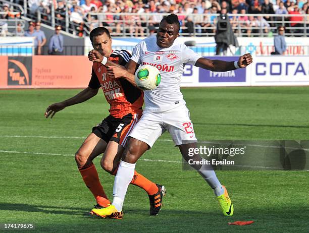 Milan Vjestica of FC Ural Sverdlovsk Oblast is challenged by Emmanuel Emenike of FC Spartak Moscow during the Russian Premier League match betweenn...