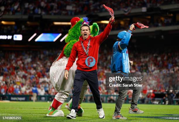 Actor Rob McElhenney reacts on the field with the Phillie Phanatic during Game Two of the Championship Series between the Philadelphia Phillies and...