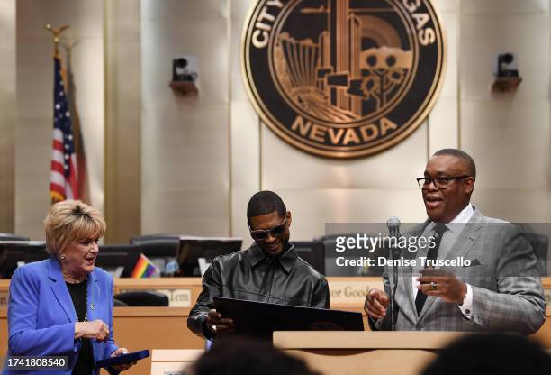 Las Vegas Mayor Carolyn Goodman, Usher and Las Vegas City Councilman Cedric Crear during a ceremony honoring Usher at Las Vegas City Hall on October...