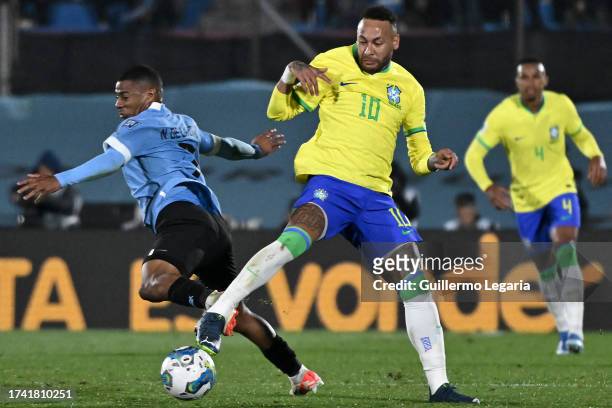 Nicolas de la Cruz of Uruguay competes for the ball with Neymar Jr. Of Brazil during the FIFA World Cup 2026 Qualifier match between Uruguay and...