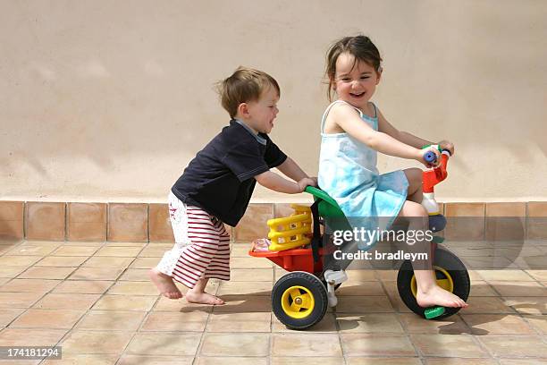 push me - tricycle stock pictures, royalty-free photos & images