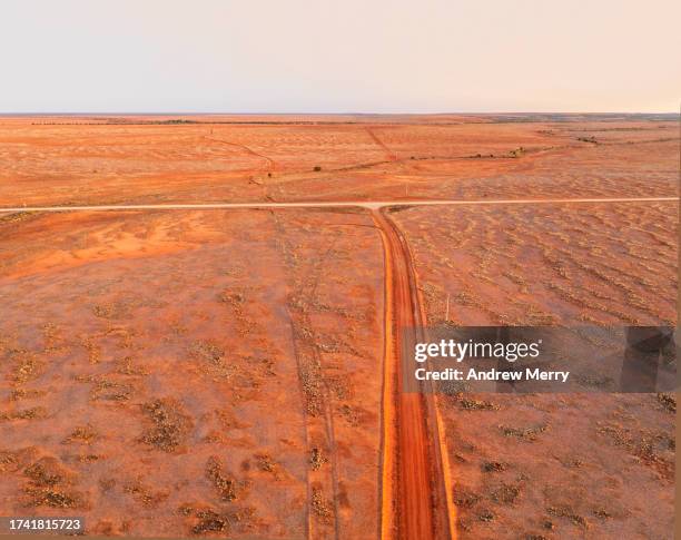 outback dirt roads at dusk australia - sturt national park stock pictures, royalty-free photos & images
