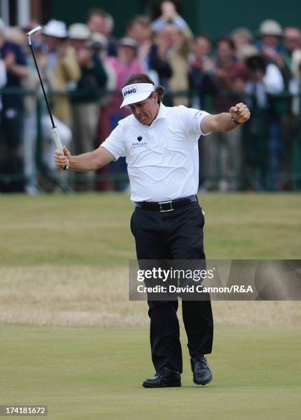 Phil Mickelson of the United States celebrates holing a birdie putt on the 18th green during the final round of the 142nd Open Championship at...