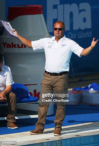 Coach Paul Metz of Great Britain looks on during the Women's Water Polo first preliminary round match between Canada and Great Britain during Day Two...