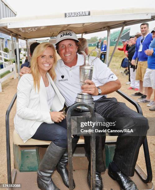 Phil Mickelson of the United States holds the Claret Jug with his wife Amy after winning the 142nd Open Championship at Muirfield on July 21, 2013 in...