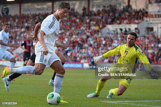 Real Madrid's Cristiano Ronaldo scores his second goal past Bournemouth's goalkeeper Darryl Flahavan during the pre-season friendly football match...