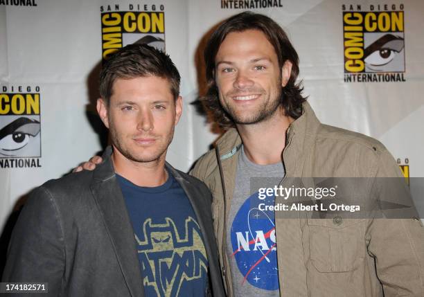 Actors Jensen Ackles and Jared Padalecki pose backstage at the "Supernatural" special video presentation during Comic-Con International 2013 at San...