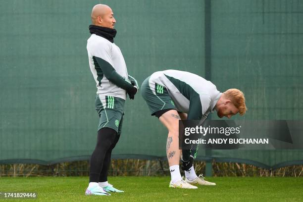 Celtic's Japanese striker Daizen Maeda and Celtic's Irish defender Liam Scales attend a team training session at the Celtic Training Centre in...