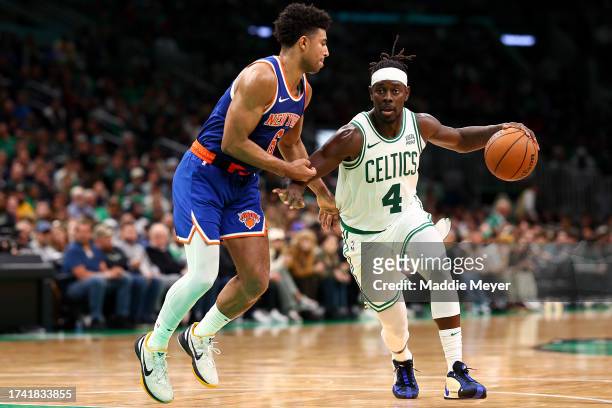 Quentin Grimes of the New York Knicks defends Jrue Holiday of the Boston Celtics during the second half of the Celtic's preseason game against the...