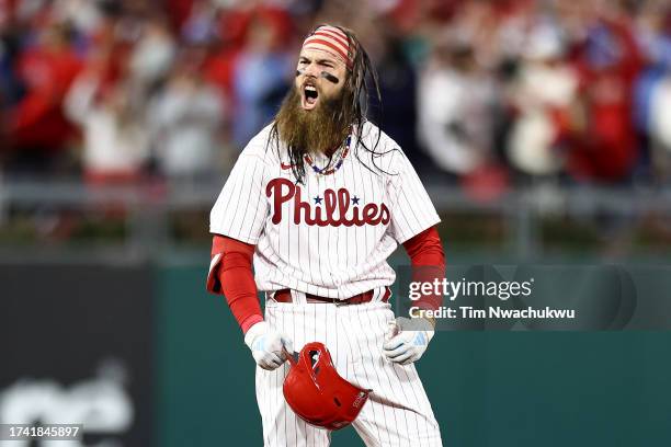 Brandon Marsh of the Philadelphia Phillies reacts after hitting a sixth inning RBI double against the Arizona Diamondbacks during Game Two of the...