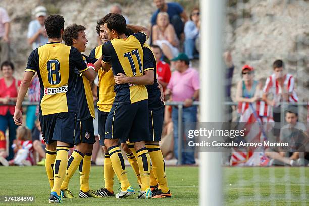 Leonardo Baptistao of Atletico de Madrid celebrates scoring their fourth goal with teammates during the Jesus Gil y Gil Trophy between Club Atletico...