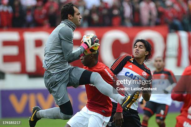 Muriel, goalkeeper of Internacional jumps for the ball with Marcelo Moreno of Flamengo during a match between Flamengo and Internacional as part of...