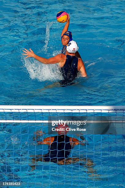 Manuela Canetti of Brazil looks to score a goal under pressure from captain Orsolya Takacs of Hungary during the Women's Water Polo first preliminary...