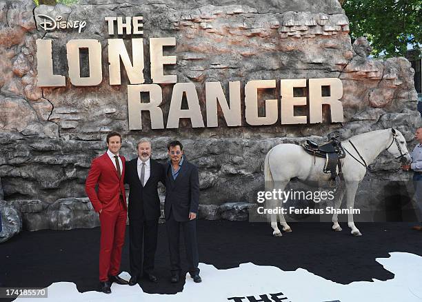 Armie Hammer, Gore Verbinski and Jonny Depp attend the UK Premiere of 'The Lone Ranger' at Odeon Leicester Square on July 21, 2013 in London, England.