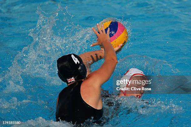 Sophie Baron le Salle of Canada is attacked by Ciara Gibson-Bryne of Great Britain during the Women's Water Polo first preliminary round match...