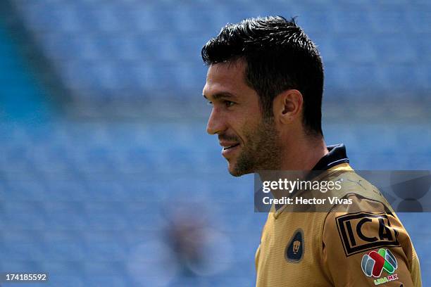 Luis Garcia of Pumas smiles during a match between Pumas and Puebla as part of the Torneo Apertura 2013 Liga Mx at Cuauhtemoc Stadium on July 21,...