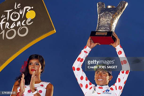Colombia's Nairo Quintana celebrates his polka dot jersey of best climber on the podium on the Champs-Elysees avenue in Paris, after winning the...