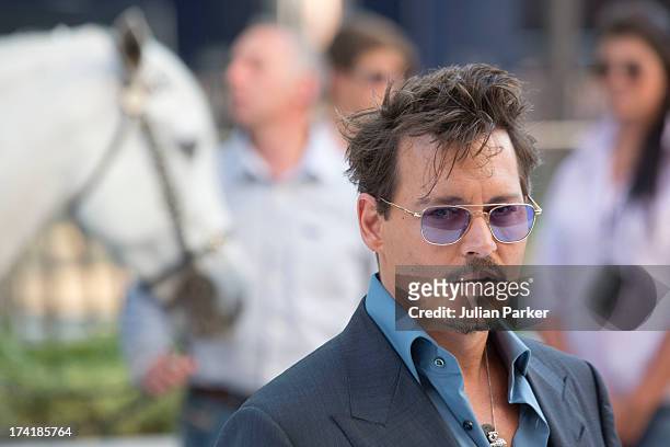 Johnny Depp attends the UK Premiere of 'The Lone Ranger' at Odeon Leicester Square on July 21, 2013 in London, England.