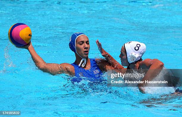 Triantafyllia Manolioudaki of Greece looks to pass against the defense of Kiley Neushul of the USA in the Women's Water Polo first preliminary round...