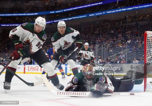 Karel Vejmelka of the Arizona Coyotes makes the save against the New York Islanders at UBS Arena on October 17, 2023 in Elmont, New York. The...