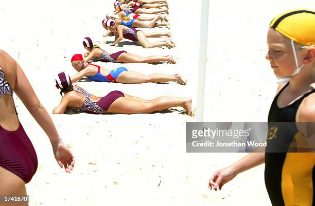 Competitors gather for the girl's 11 years Beach Flag event during the Sunshine Coast Junior Teams Carnival at Mooloolaba Beach on the Sunshine...
