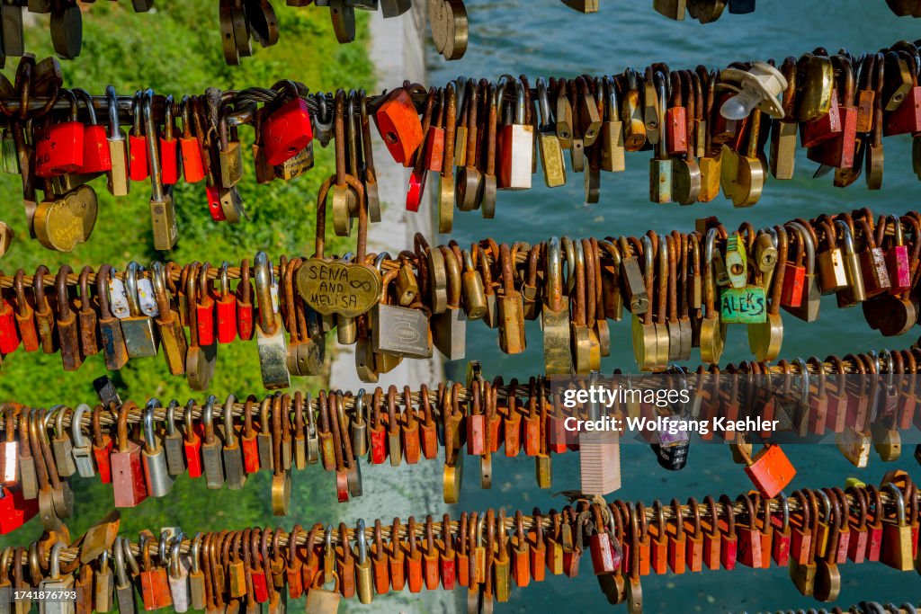 Lovers have symbolically padlocked their love on the...