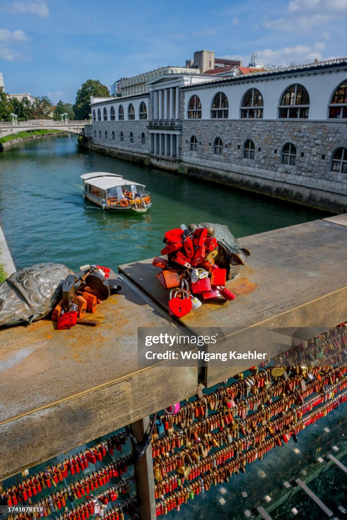 Lovers have symbolically padlocked their love on the...