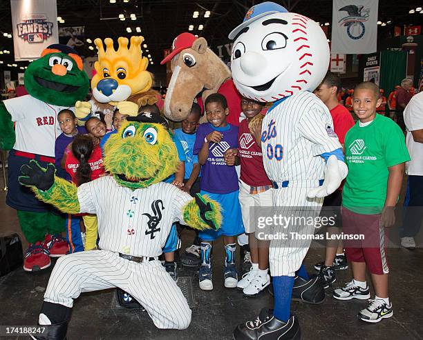 Boys and Girls Club kids pose with team mascots on the Opening Day of T-Mobile All-Star FanFest at the Jacob K. Javits Convention Center on Friday,...