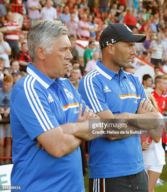 Real Madrid's coach Carlo Ancelotti and assistant Zinedine Zidane looks on as his team play during the pre-season friendly football match between...