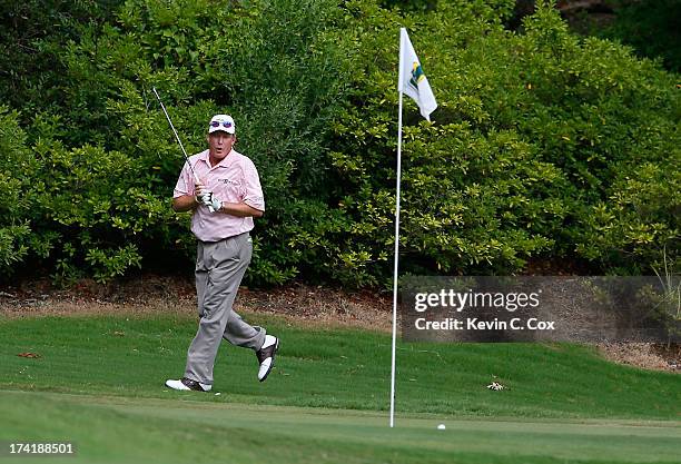 Woody Austin reacts after nearly chipping in for birdie on the 17th hole during the final round of the Sanderson Farms Championship at Annandale Golf...