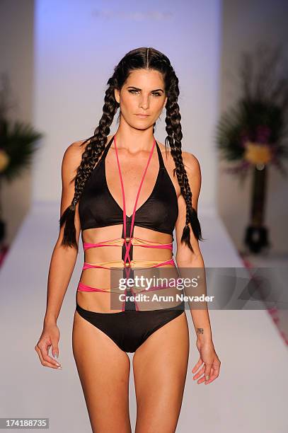 Model walks the runway during the Aqua Di Lara fashion show at Mercedes-Benz Fashion Week Swim 2014 at Raleigh Hotel on July 20, 2013 in Miami Beach,...