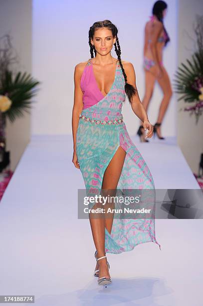 Model walks the runway during the Aqua Di Lara fashion show at Mercedes-Benz Fashion Week Swim 2014 at Raleigh Hotel on July 20, 2013 in Miami Beach,...