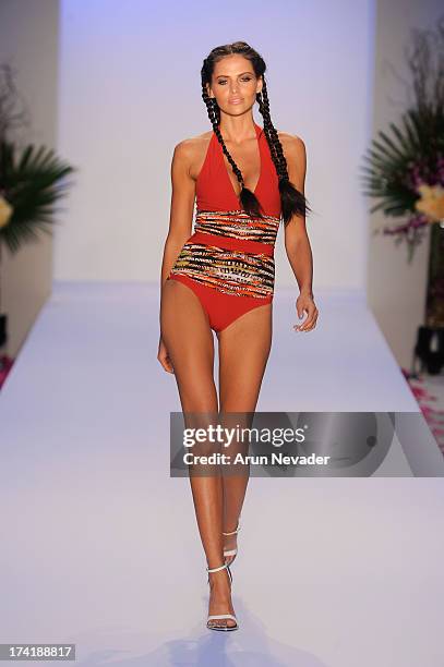 Model walks the runway during the Aqua Di Lara fashion show at Mercedes-Benz Fashion Week Swim 2014 at Raleigh Hotel on July 20, 2013 in Miami Beach,...