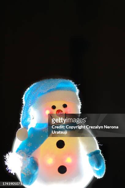 snowman with santa claus hat,hand warmer gloves and neck gaiter (10) plus white led backlit - buff stock pictures, royalty-free photos & images