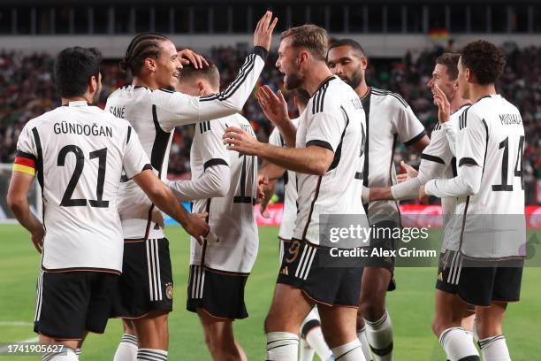 Niklas Fuellkrug of Germany celebrates the team's second goal with teammates during the international friendly between Germany and Mexico at Lincoln...